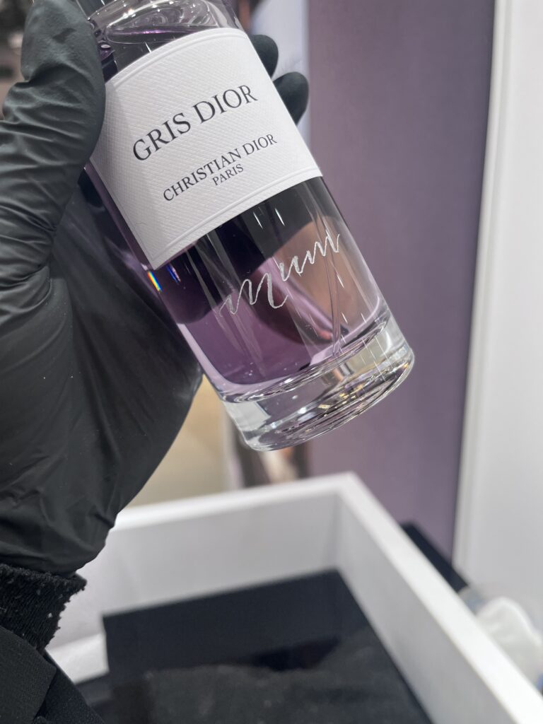 Live engraving on Dior beauty products at Harrods Beauty Chester
