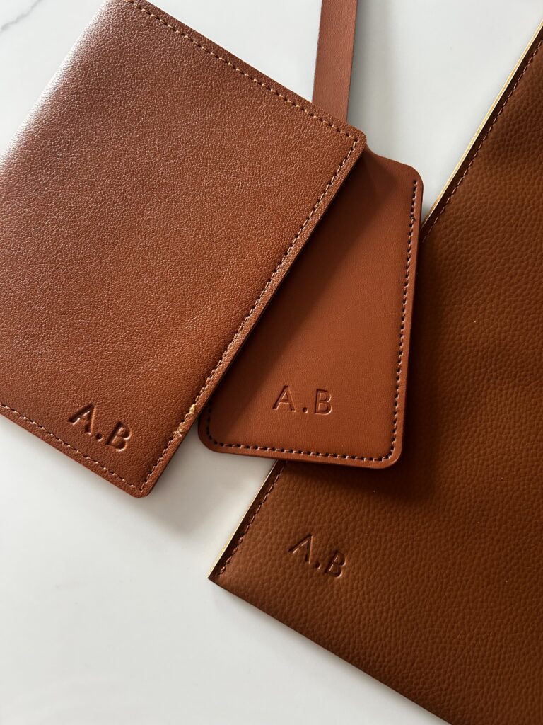 Embossed luggage tag, passport holder and document wallet in tan brown for influencer gifting